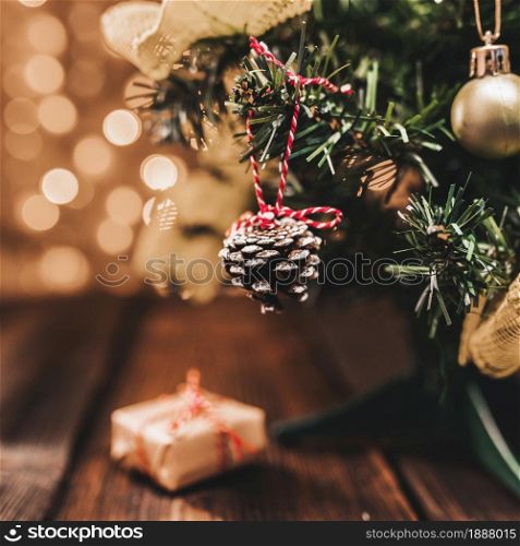 little decorated fir tree on wood desk . Resolution and high quality beautiful photo. little decorated fir tree on wood desk . High quality and resolution beautiful photo concept