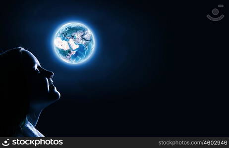 Little dreamer. Cute girl of school age against night background. Elements of this image are furnished by NASA