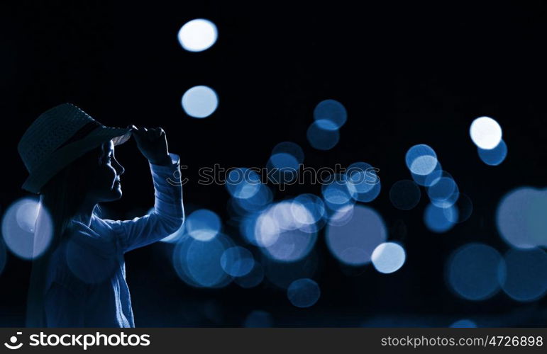 Little dreamer. Cute girl of school age against night background