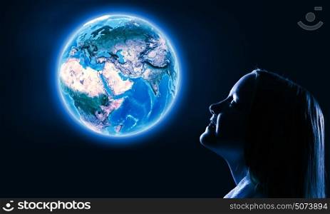 Little dreamer. Cute girl of school age against night background. Elements of this image are furnished by NASA