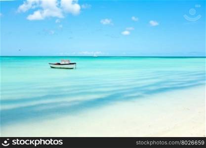 Little fishing boat in the caribbean sea on Aruba island