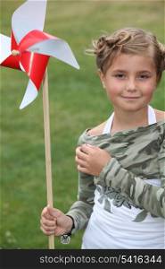 little girl and a paper windmill