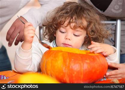 little girl and pumpkin