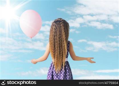 Little girl and the pink balloon