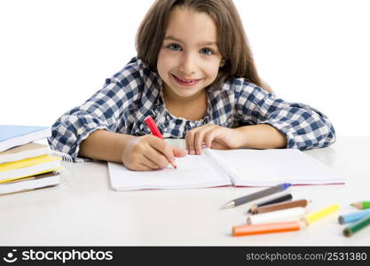 Little girl at school making drawings and painting