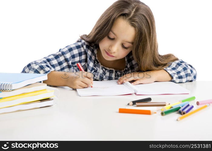 Little girl at school making drawings and painting