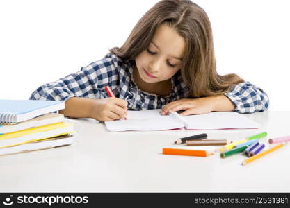 Little girl at school making drawings and painting