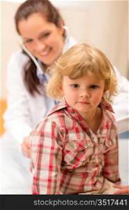 Little girl being examine with stethoscope by pediatrician