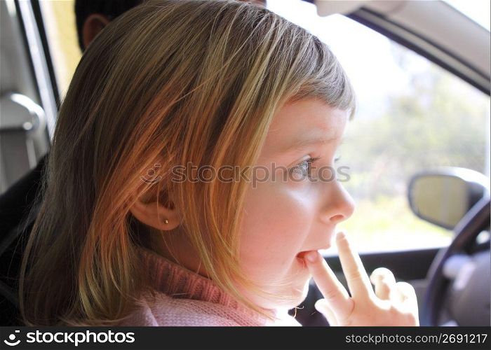 little girl blond profile car vehicle interior portrait