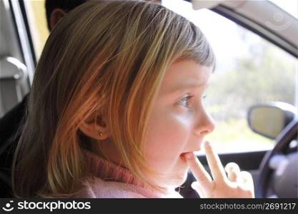 little girl blond profile car vehicle interior portrait