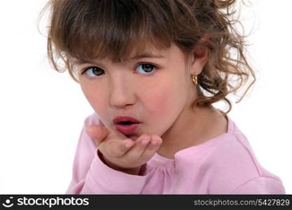 Little girl blowing kiss