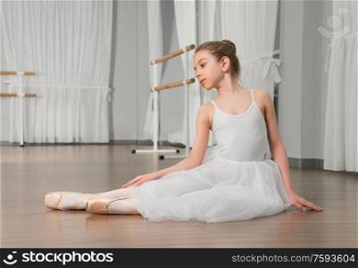 Little girl classic ballet dancer in studio
