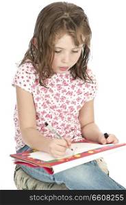 Little girl drawing on a sketchpad.