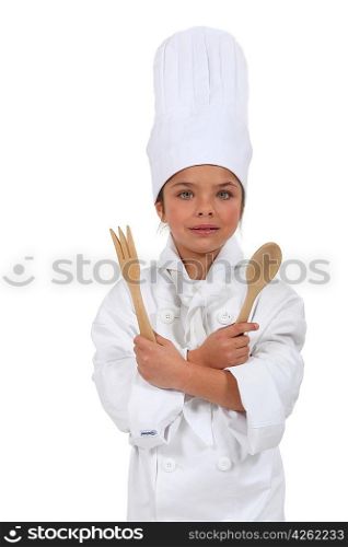 little girl dressed as cook