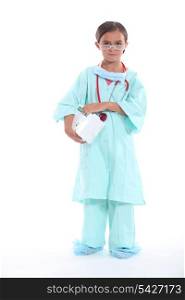 Little girl dressed in nurses uniform