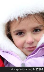 little girl dressed with warm clothes