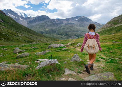 Little girl during a summer camp for kids in the mountains