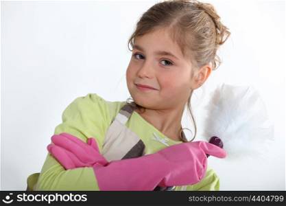 Little girl dusting