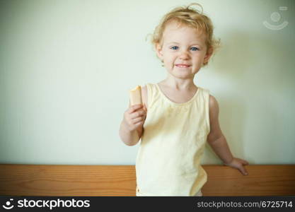 Little girl eating a cookie