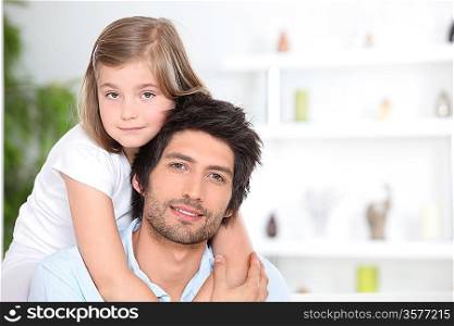 Little girl embracing her father