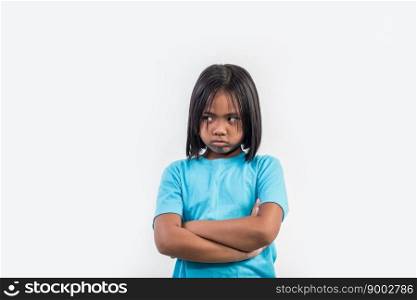 little girl feel angry in studio shot