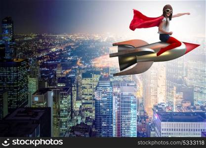 Little girl flying rocket in superhero concept