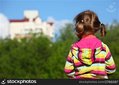 Little girl from back, trees and houses