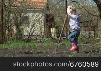 Little Girl Gardener Digging on Smallholder Farm