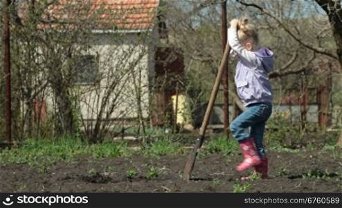 Little Girl Gardener Digging on Smallholder Farm