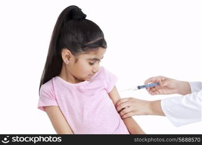 Little girl getting an injection
