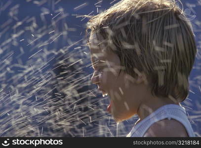 Little Girl Getting Sprayed in the Face with Water