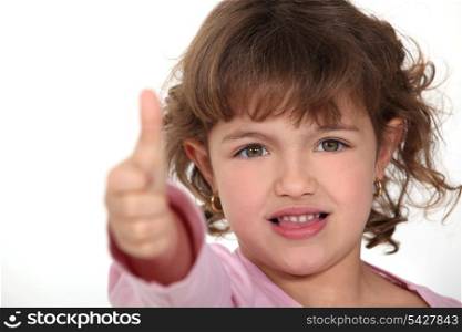 Little girl giving the thumbs-up