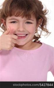 Little girl giving thumbs-up
