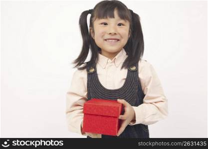 little girl holding a present