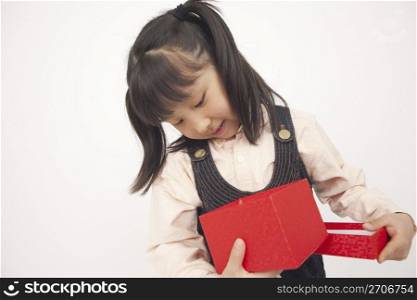 little girl holding a present
