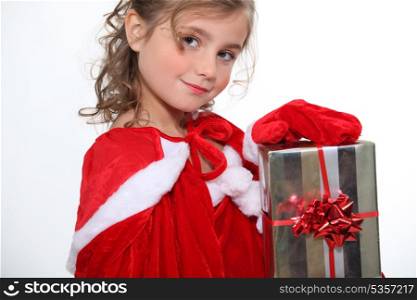 Little girl holding Christmas present