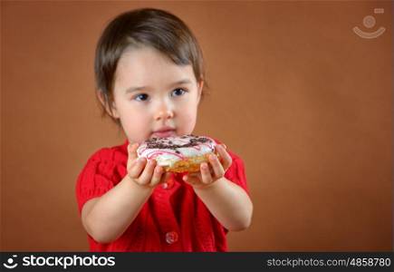little girl holding donuts shoot in studio