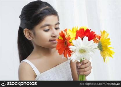 Little girl holding flowers