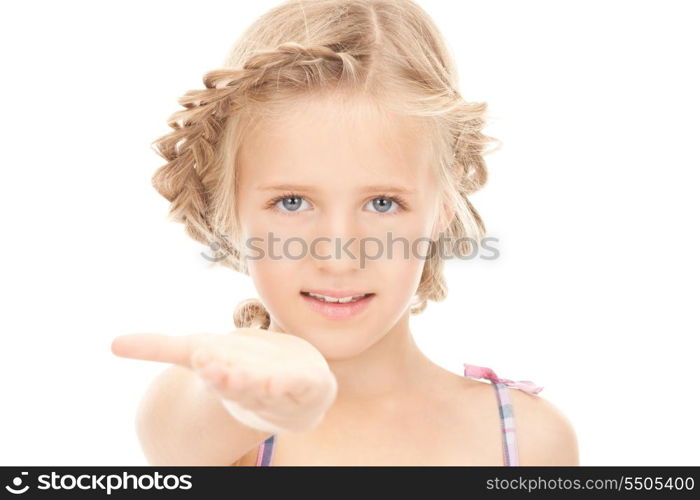 little girl holding something on the palm of her hand&#xA;