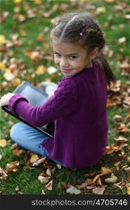 Little Girl holding tablet digital computer ??????? ???????? ??????? ? ??????? ?????