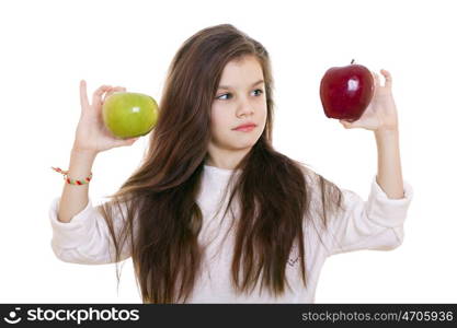 Little girl holding two apples, isolated on white background