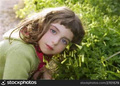 little girl hug grass happy in green meadow outdoor nature park
