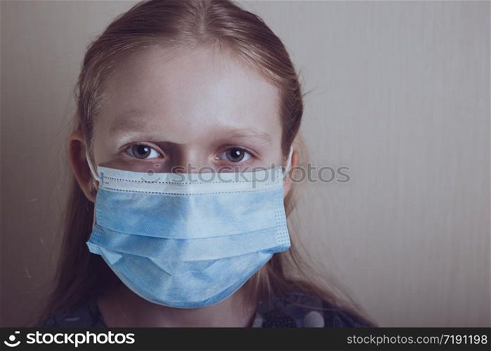 little girl in a medical mask