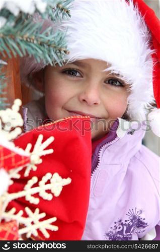 Little girl in a Santa hat