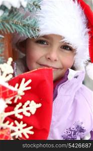 Little girl in a Santa hat