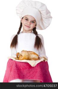 Little girl in a white apron holds on a plate of fried chicken, isolated on white background