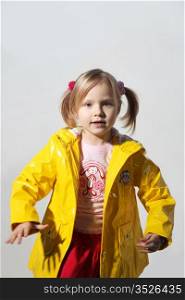 Little girl in a yellow jacket