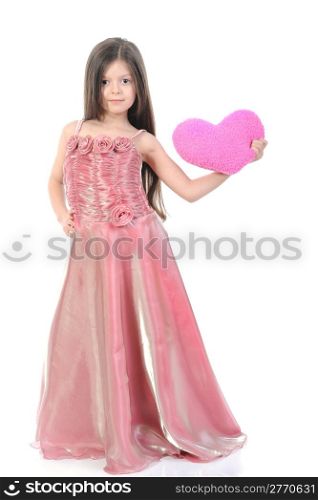 little girl in evening dress with a heart. Isolated on white background
