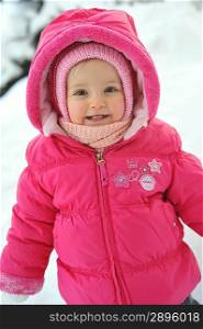 little girl in red jacket in winter
