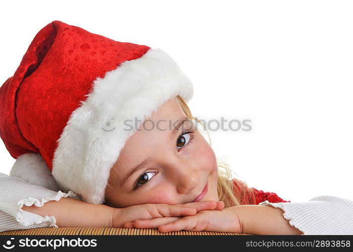 little girl in red santa hat on white background. portrait